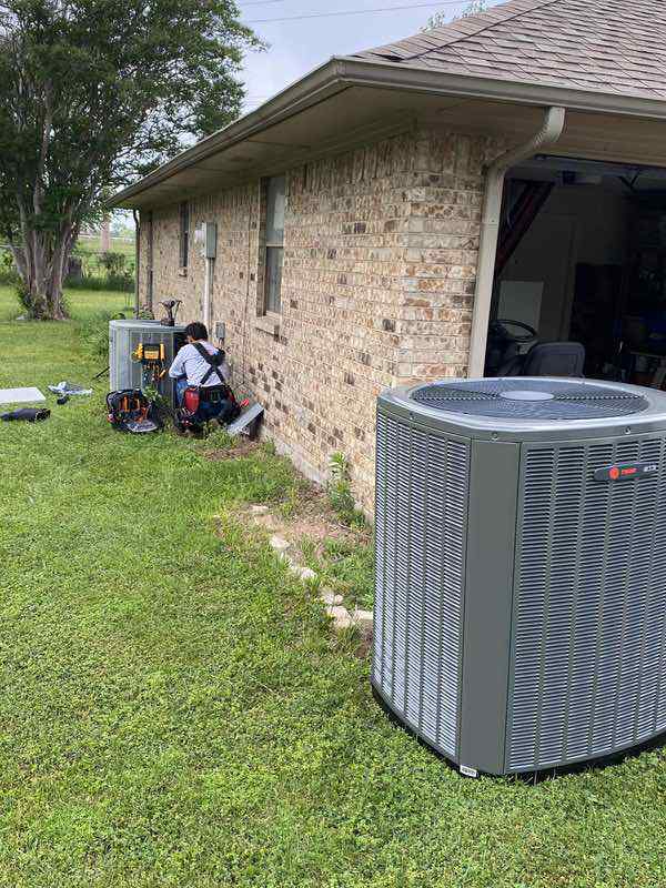 Bolton Heating & Air repairing a broken ac unit at a home in the DFW metroplex